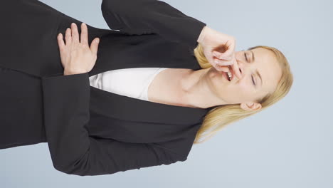 Vertical-video-of-Sneezing-business-woman.